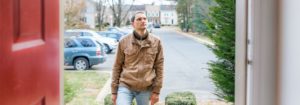 Man about to enter house