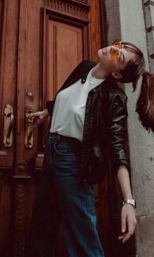 Woman hanging to pull open door