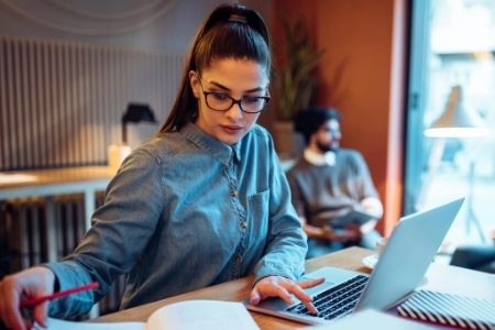 woman studying with laptop